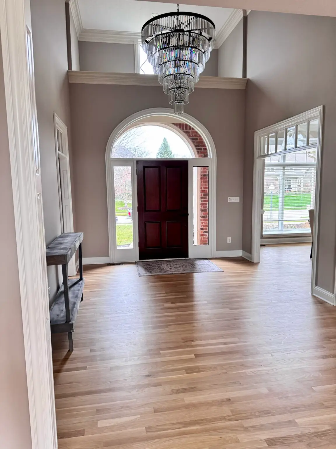 Freshly painted foyer with arched entry door, Carmel Indiana
