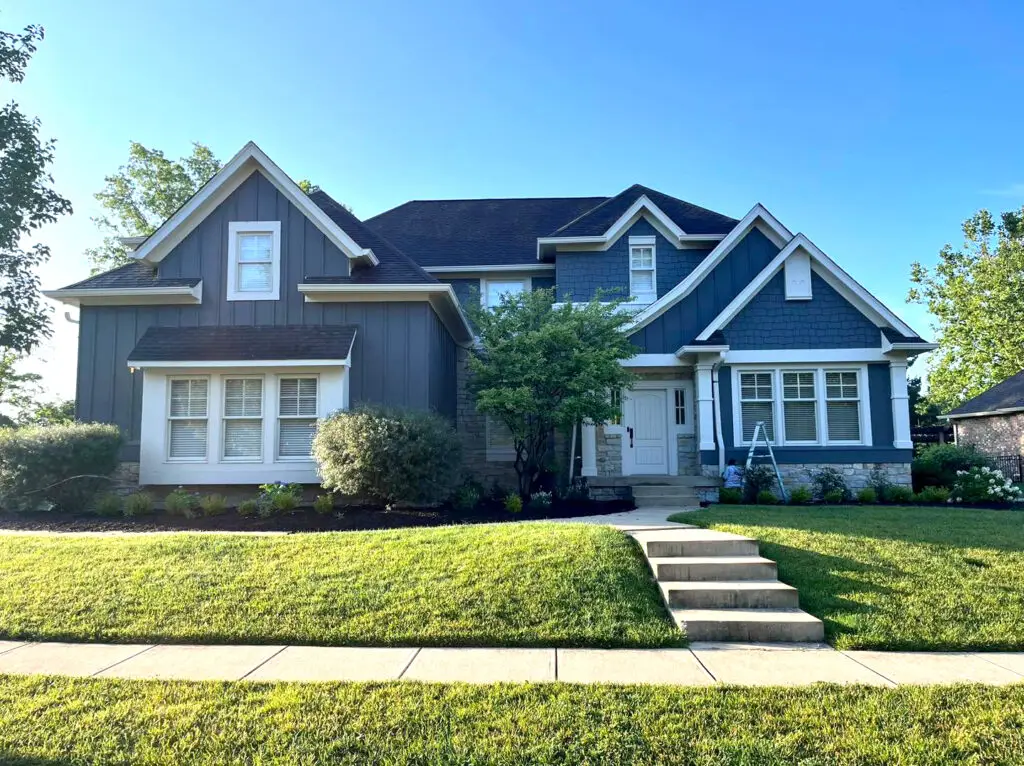 Slate-blue exterior repaint on a Carmel craftsman home