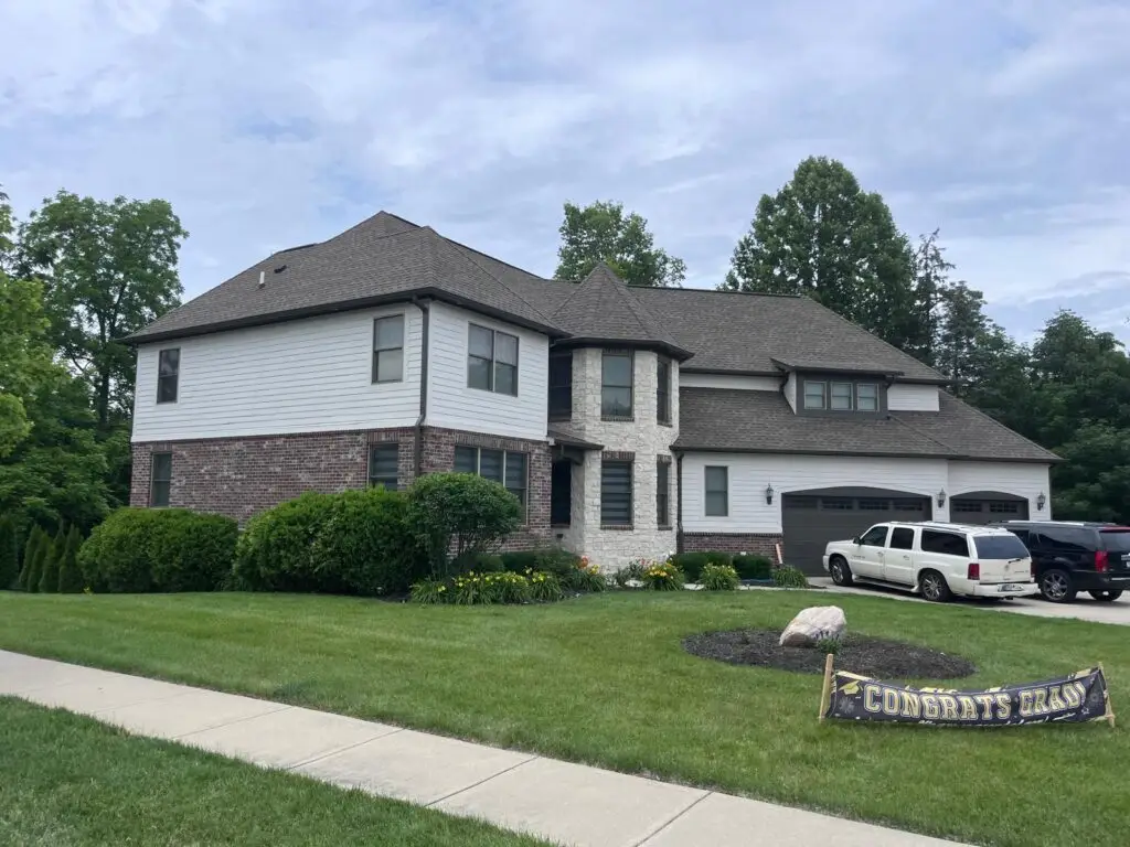 Completed exterior repaint on a large two-story home in Carmel, Indiana