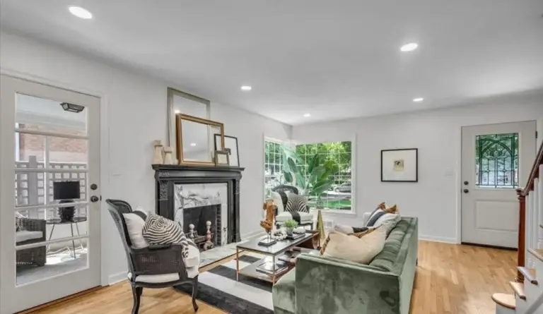 A cozy family room in an Indianapolis home, painted by AltaVista Painting Pro, weaves a tale of warmth with soft taupe low-VOC paints, creating an inviting space for family memories.