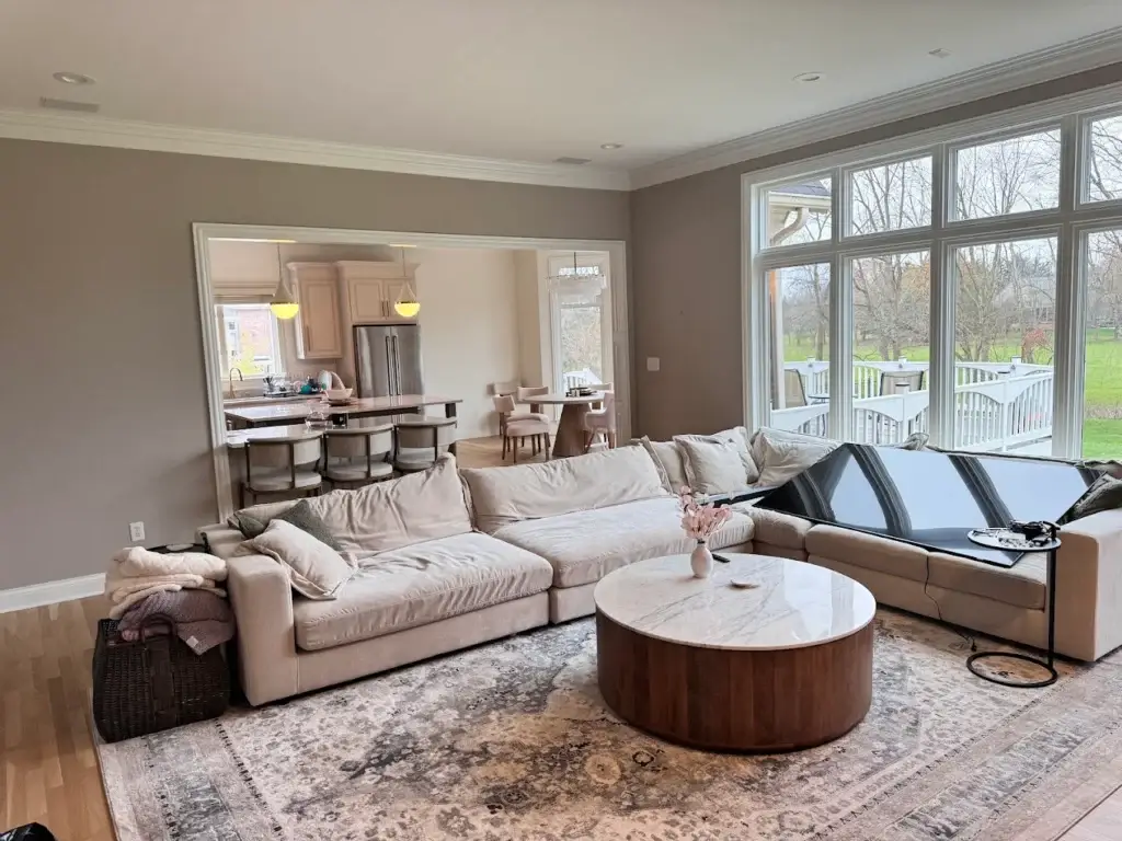 Interior painting — living room with neutral walls and crisp white trim, Carmel IN