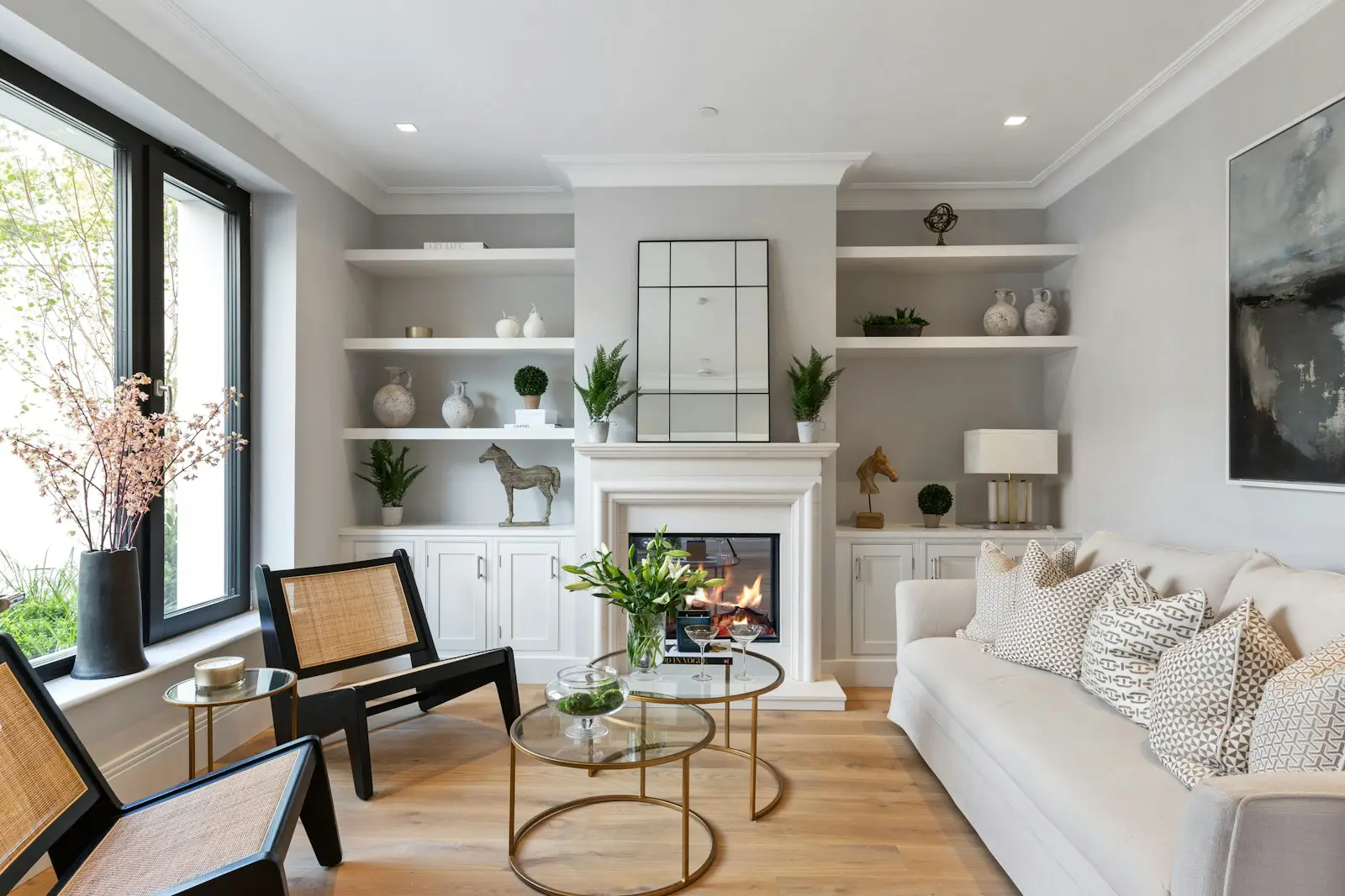 Living room with freshly painted light gray walls and crisp white trim