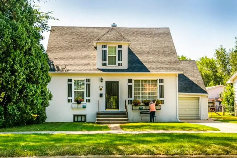 Paint care and maintenance guide cover showing a freshly painted white home exterior in Carmel, Indiana