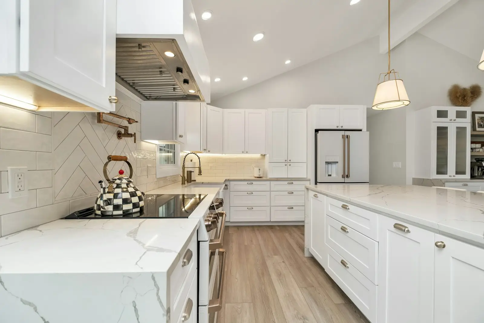White painted kitchen cabinets kept clean and grease free through regular paint care and maintenance